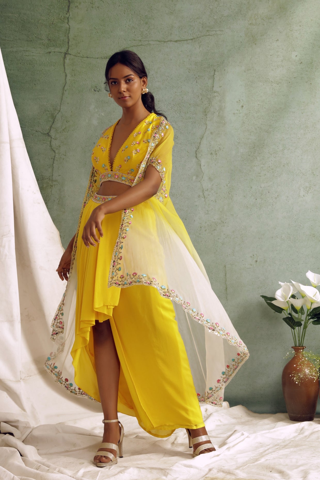 Yellow crop top with draped skirt and cape